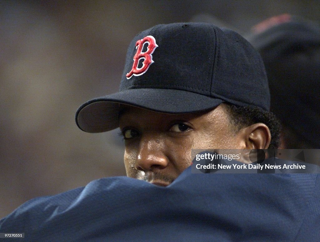 Boston Red Sox' pitcher Pedro Martinez watches as his team p