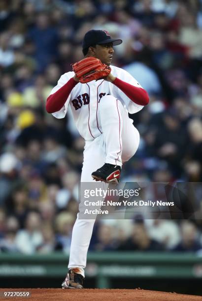Boston Red Sox' pitcher Pedro Martinez winds up in the first inning of Game 3 of the American League Championship Series against the New York Yankees...