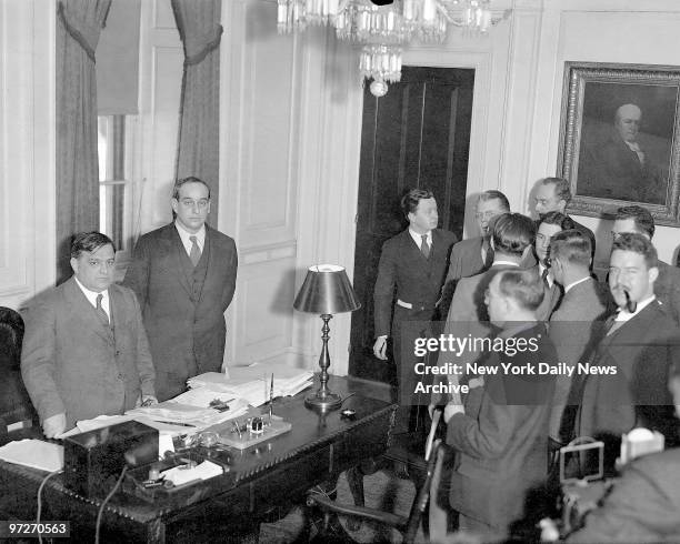 Moses Gets Bridge Job, Mayor LaGuardia with Robert Moses standing beside him, announces appointment of Moses to Triboro Bridge Authority to succeed...