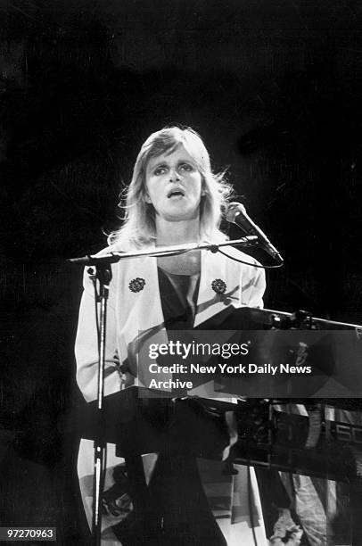 Linda McCartney plays the keyboard during a concert with Paul McCartney at the Meadowlands.