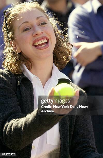 First Daughter Chelsea Clinton offers a big thank-you smile to ball boys who presented her with a tennis ball at the end of the match between Anke...