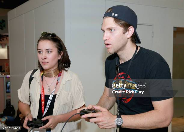 Zelda Williams and Keegan Allen visit the Nintendo booth during the 2018 E3 Gaming Convention at Los Angeles Convention Center on June 12, 2018 in...