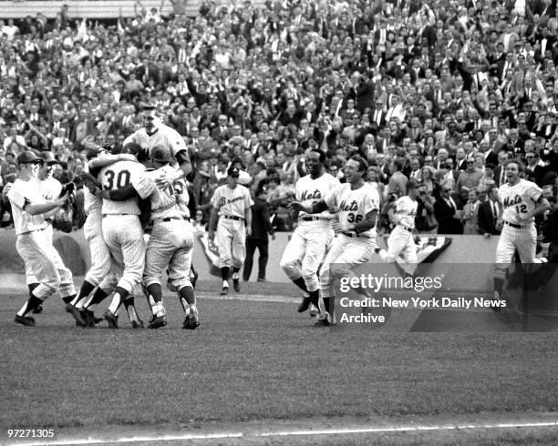 Mets vs. Atlanta Braves. 1969 National League Championship Series. Game 3. Tom Seaver is head and shoulders above mates who mob winning pitcher Nolan...