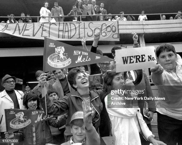 Mets vs. Atlanta Braves. 1969 NLC Series. Game 3., Jubilant Mets fans hang out "We Never Had It So Good" banner as they whoop it up before clincher.