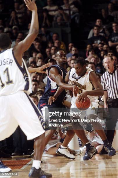 Connecticut Huskies' Emeka Okafor reaches in to grab the ball from Pittsburgh Panthers' Chris Taft during Big East championship game at Madison...