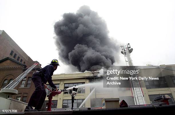 Firefighters battle three alarm fire that ripped through art galleries and a restaurant at 429 W. 14th St. Fourteen firefighters were injured and...