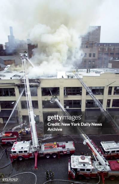 Firefighters battle three alarm fire that ripped through art galleries and a restaurant at 429 W. 14th St. Fourteen firefighters were injured and...