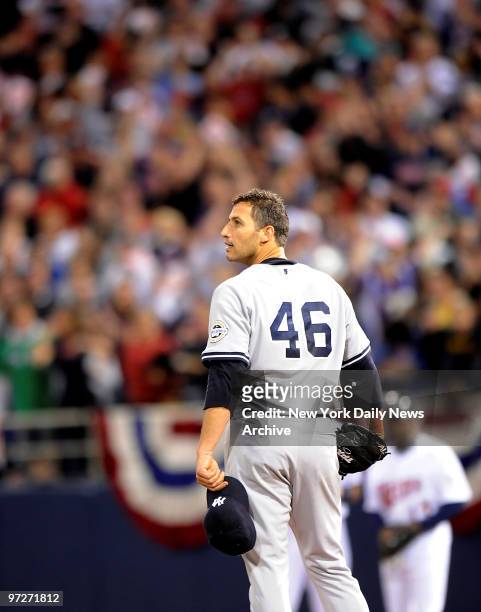New York Yankees against the Minnesota Twins in Game 3 of the American League Division Series. Andy Pettitte reacts after giving up RBI single to Joe...