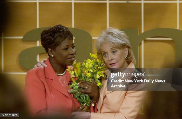 Iyanla Vanzant gets flowers and a hug from Barbara Walters at the taping of Vanzant's new talk show at the CBS-TV studio on W. 57th St.