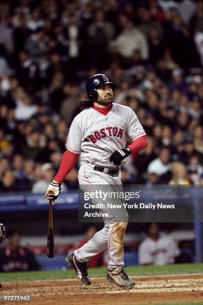 Boston Red Sox's Johnny Damon watches the ball fly after hitting a grand slam in the second inning of Game 7 of the American League Championship...