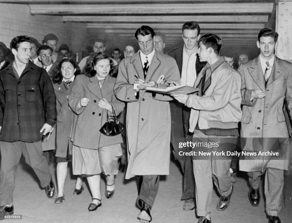 The Yanks ARE IN (Town), Joe DiMaggio signs autographs for f