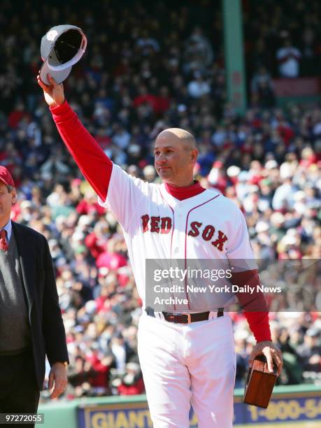 Boston Red Sox's Manager Terry Francona waves to cheering fans as he receives his 2004 World Series Championship ring during ceremonies before the...