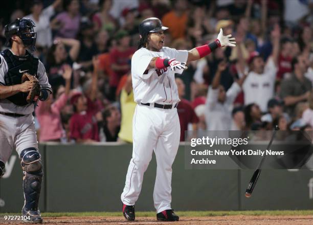 Boston Red Sox's Manny Ramirez drops his bat and admires his shot to left-center for a solo homer in the ninth inning against the New York Yankees at...