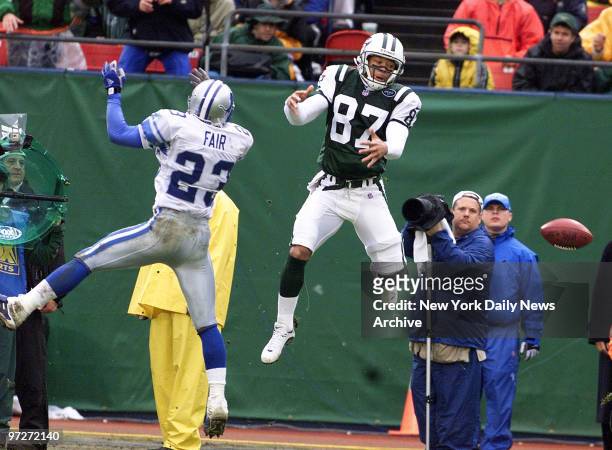 It could be an aerial ballet as the New York Jets' Laveranues Coles takes off but misses pass in the second half while the Detroit Lions' Terry Fair...