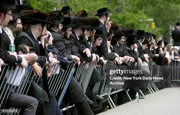 Mourners gather in front of 78 Wilson St. In Williamsburg, Brooklyn, after deaths of granddaughter and great-granddaughter of Hasidic spiritual...