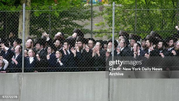 Mourners gather in front of 78 Wilson St. In Williamsburg, Brooklyn, after deaths of granddaughter and great-granddaughter of Hasidic spiritual...