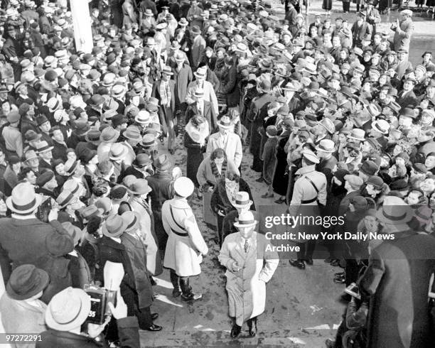 The Bruno Richard Hauptmann jury passes through crowd toward the courthouse. Hauptmann is charged with kidnapping and murdering Charles Augustus...