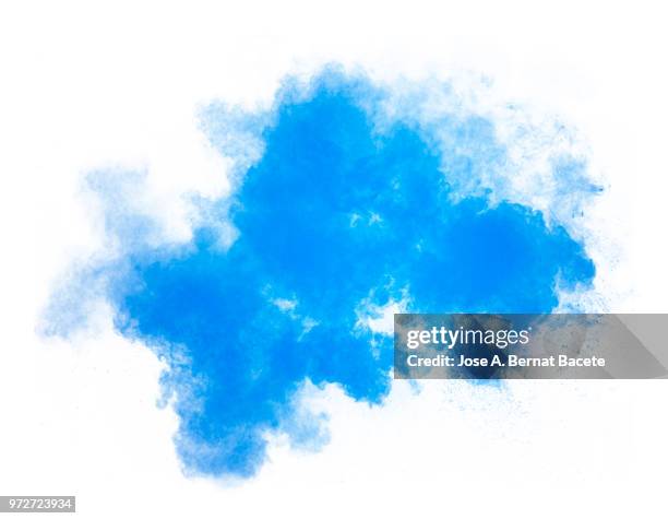 full frame of forms and textures of an explosion of powder and smoke of color light blue and dark blue on a white background. - blue smoke stockfoto's en -beelden