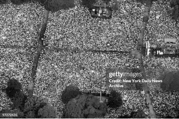 It was a day of miracles and wonder as fans jammed Central Park's Great Lawn to hear Paul Simon perform a free concert.