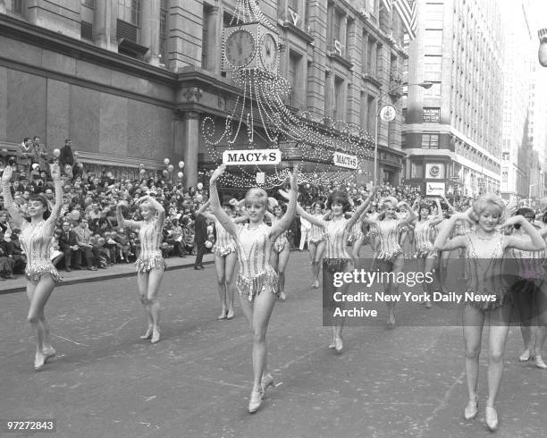 It's a fine marching day for Radio City Rockettes, who brighten the Macy's Thanksgiving Day parade on 34th St.