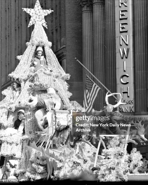 Santa Claus waves during Macy's Thanksgiving Day parade. An estimated throng of 1 000 spectators lined the parade route from Central Park West and...