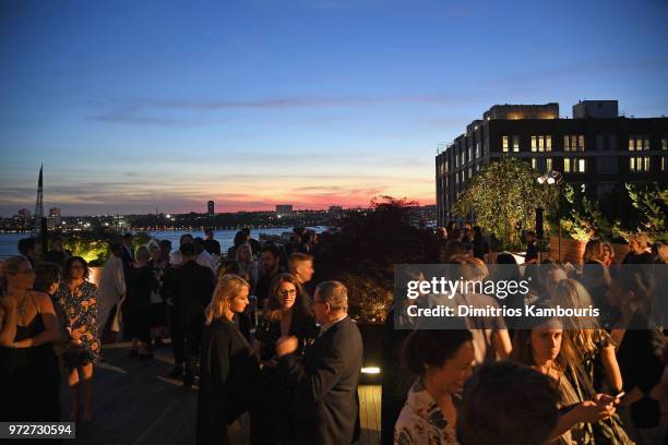 Guests enjoy the rooftop during the International Medical Corps summer cocktail event hosted by Sienna Miller and Milk Studios at Milk Studios on...