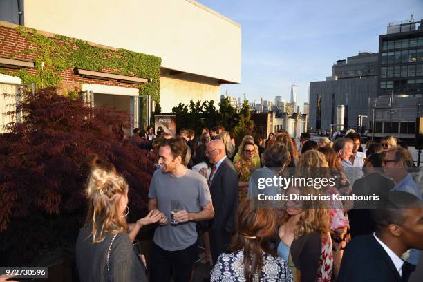 Guests enjoy the rooftop during the International Medical Corps summer cocktail event hosted by Sienna Miller and Milk Studios at Milk Studios on...