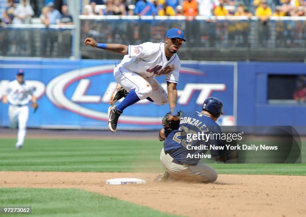 New York Mets vs San Diego Padres. Game 3. Mets Argenis Reyes makes toss from ground to Jose Reyes who gets force at 2nd on San Diego Padres Adrian...