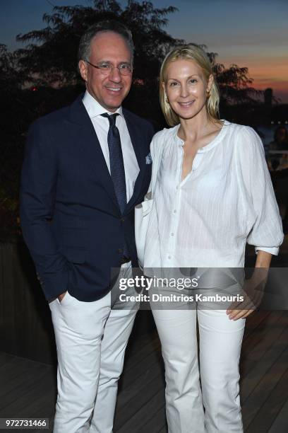 Andrew Saffir and Kelly Rutherford attend the International Medical Corps summer cocktail event hosted by Sienna Miller and Milk Studios at Milk...