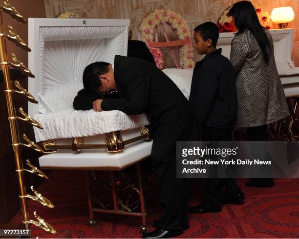 Mourners say goodbye during wake for Family killed in Chelsea fire, Delkis Balbuena and children Jonzan, Nanny, Bet-el and Ruth at Ortiz Funeral Home...