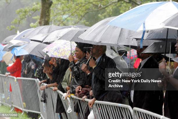 Mourners wait for hours in the pouring rain to attend funeral services for Luther Vandross at the Riverside Church on the upper West Side. The R&B...