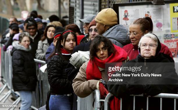Mourners wait on line outside the Ortiz Funeral Home on First Ave. In Manhattan to pay their respects to 7-year-old Nixzmary Brown, whose battered...