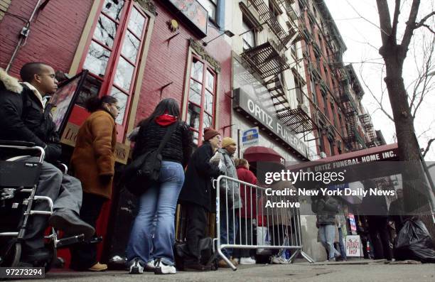 Mourners wait on line outside the Ortiz Funeral Home on First Ave. In Manhattan to pay their respects to 7-year-old Nixzmary Brown, whose battered...