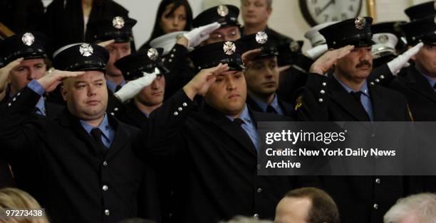 Firefighters salute during a plaque-dedication ceremony for Firefighter Thomas Brick at Engine 95, Ladder 36 firehouse in Inwood in upper Manhattan....