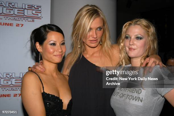 Lucy Liu, Cameron Diaz and Drew Barrymore huddle at a showing of "Charlie's Angels: Full Throttle" at the Sony Lincoln Square theater. They star in...