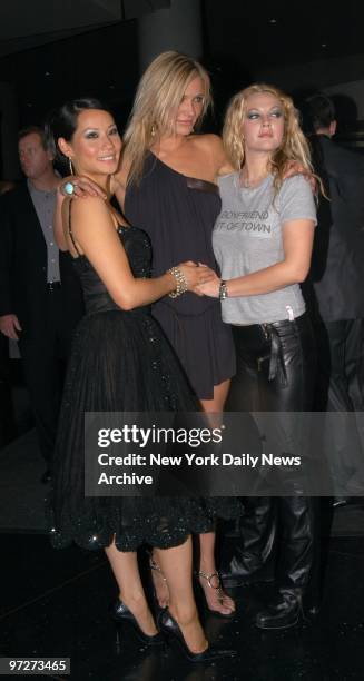 Lucy Liu, Cameron Diaz and Drew Barrymore huddle at a showing of "Charlie's Angels: Full Throttle" at the Sony Lincoln Square theater. They star in...