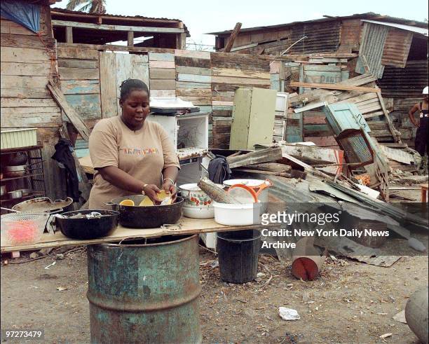 Lucy Penn works in makeshift kitchen after Hurricane Georges swept through Santo Domingo.