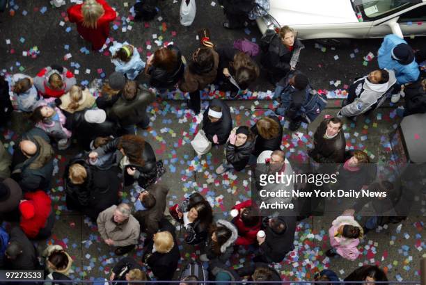 Confetti flutters down on pedestrians at 46th St. And Broadway as the Times Square Alliance does their annual confetti flight test in preparation for...