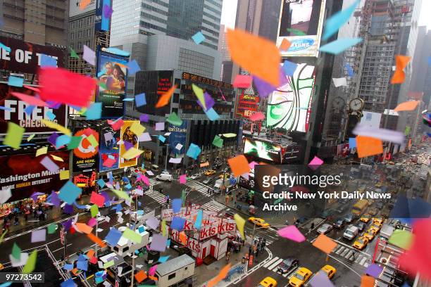 Confetti flutters through the air as members of the Times Square Alliance and Countdown Entertainment conduct the annual "airworthiness test" of...