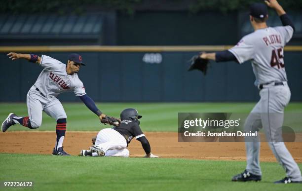 Francisco Lindor of the Cleveland Indians appears to tag out Yolmer Sanchez of the Chicago White Sox but Sanchez advanced on a balk by Adam Plutko in...