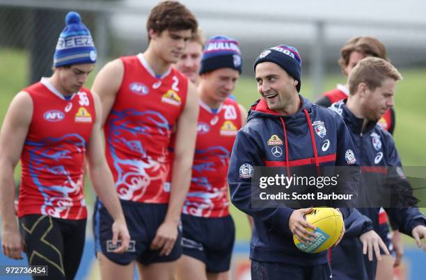 Luke Dahlhaus of the Bulldogs runs with the ball during a Western Bulldogs AFL training session at Whitten Oval on June 13, 2018 in Melbourne,...