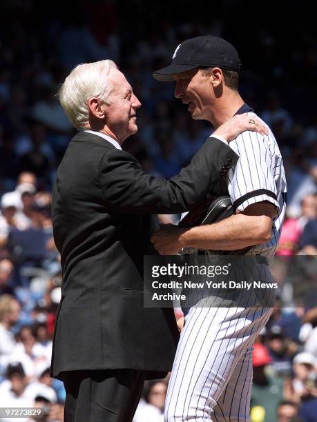 It's Whitey Ford Day and the great New York Yankees' pitcher says an encouraging word to pitcher David Cone on the mound before the game at Yankee...