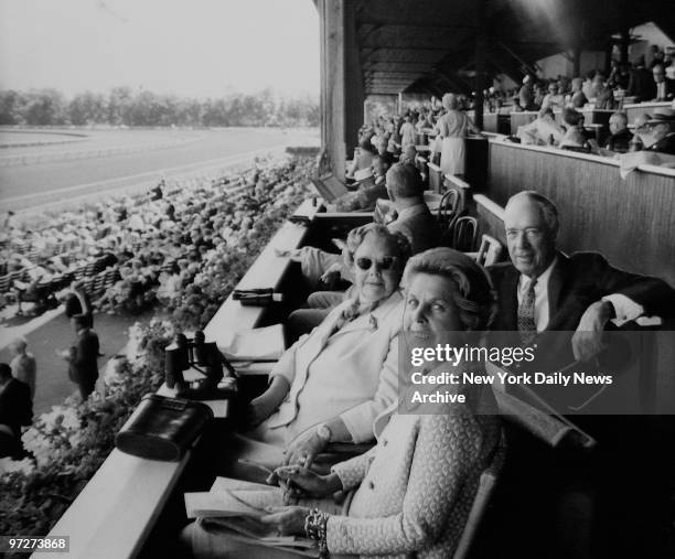 Mr. And Mrs. Henry Bain with Joan Payson at Saratoga Race Track.