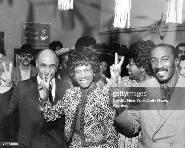 Congresswoman Shirley Chisholm flashes victory sign at her campaign headquarters at 1467 Bedford Avenue, Brooklyn.