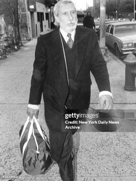 Ivan Boesky, who has paid his $100 million fine for insider trading rap, strides purposefully out of halfway house at 988 Myrtle Avenue, Brooklyn, to...