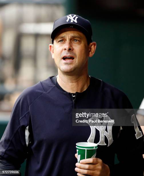 Manager Aaron Boone of the New York Yankees walks in the dugout in an interleague MLB baseball game against the New York Mets on June 8, 2018 at Citi...