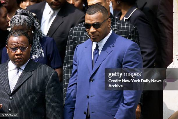 Boxer Mike Tyson leaves St. Ignatius Loyola Roman Catholic Church on E. 84th St. After attending funeral service for R&B star Aaliyah. The...