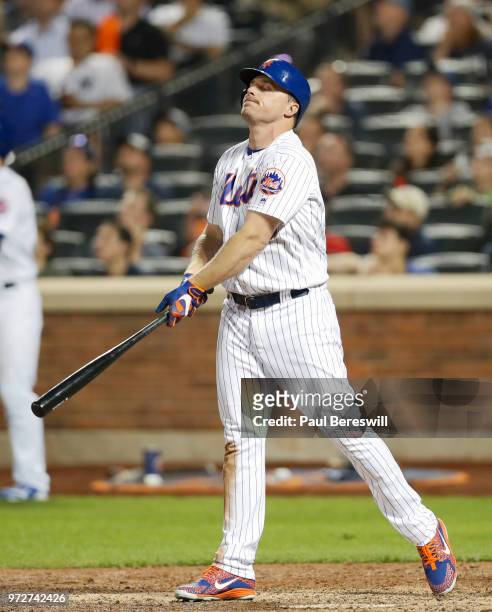 Jay Bruce of the New York Mets reacts to hitting a fly ball out for the last out of the Mets loss in an interleague MLB baseball game against the New...