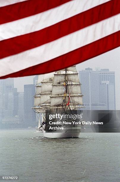 The Danish Class A tall ship Danmark is seen from the deck of the Coast Guard cutter Harriet Lane as it sails into New York Harbor against the...