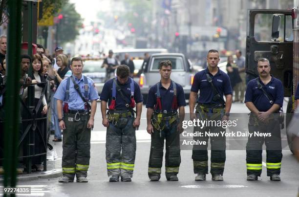 Firefighters, some of whom came straight from rescue work at the site of the former World Trade Center, pay their respects to their fallen comrade,...